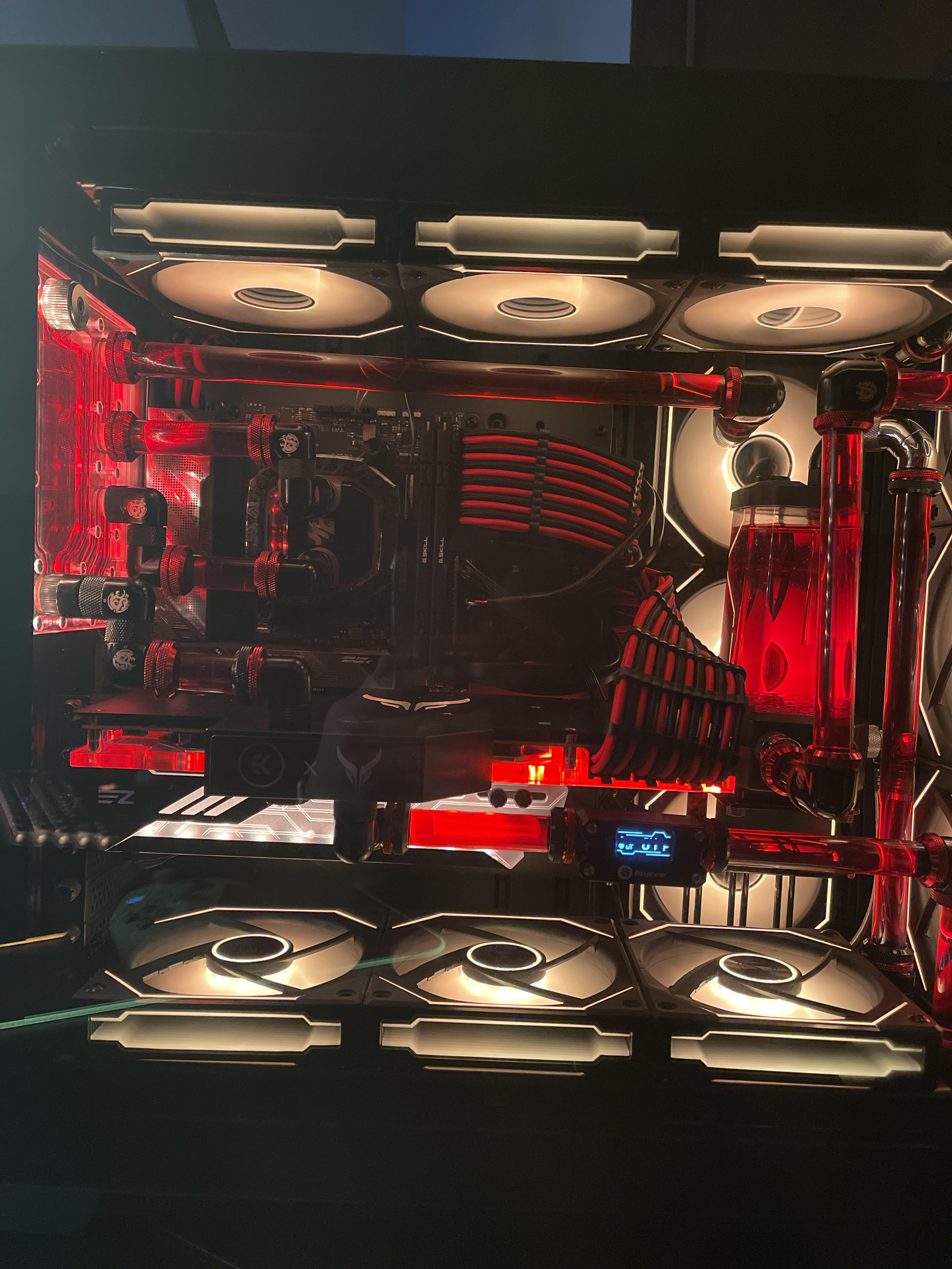 A close up of a computer case with red lights